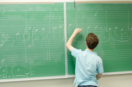 Image of student at blackboard