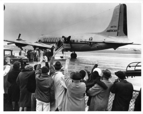 Members of the Eastman Philharmonia preparing to board their plane at Rochester