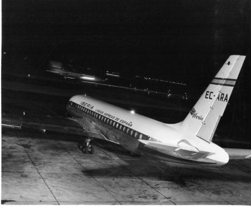 Members of the Eastman Philharmonia boarding their chartered plane at Idlewild Airport to begin their three-month tour. Photos by Louis Ouzer.