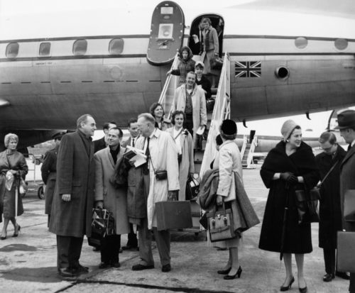 Members of the Eastman Philharmonia, accompanied by their two conductors and chaperones, are here seen alighting from their jet on arrival at Lisbon.