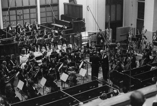 With the members of the Eastman Philharmonia in place, conductor Walter Hendl, organist David Craighead, and composer Samuel Adler acknowledge the applause after the performance of the Concerto for Organ and Orchestra.