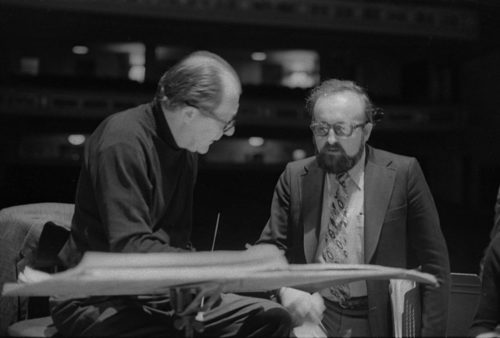Conductor Walter Hendl, composer Krystof Penderecki, and soloist Felicja Blumental conferring over the score in the Eastman Theater. Ms. Blumental’s husband Markus Mizne is seen in the background in several of these shots.