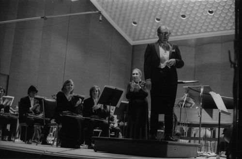 Eastman Philharmonia concert that featured the premiere of Krzystof Penderecki’s Partita for Harpsichord and Orchestra. At the conclusion of the Partita, Maestro Hendl invites the composer to the stage for bows. In the last shot, the composer, the soloist, and the conductor all join hands to acknowledge the applause.