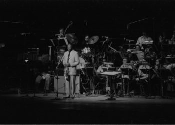 Thad Jones announcing selections from the stage during his appearance with the Eastman Jazz Ensemble