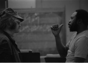 Thad Jones in conversation with Ray Wright and an unidentified member of the Eastman Jazz Ensemble