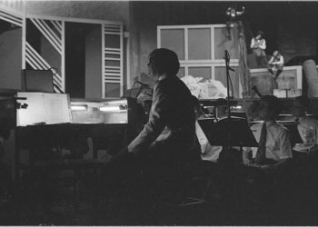 Conductor Donald Hunsberger seen in silhouette. Highland Park Bowl, July 13, 1973.