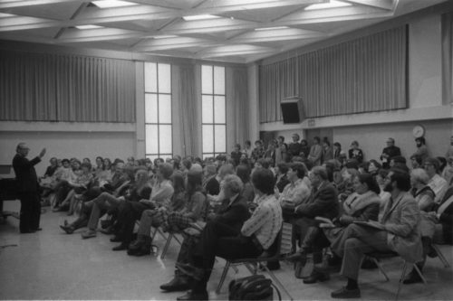 r. Schonberg making points to the large audience of listeners.