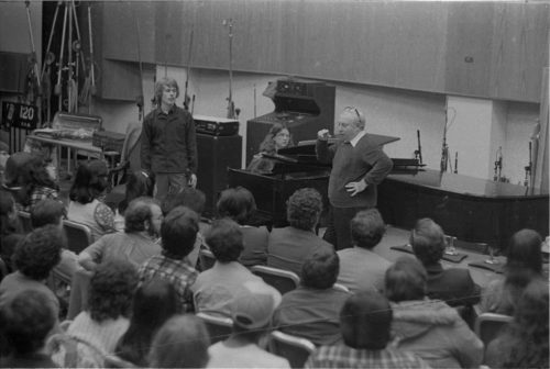 Violinist Isaac Stern working with an Eastman violin student during a master class in Room 120