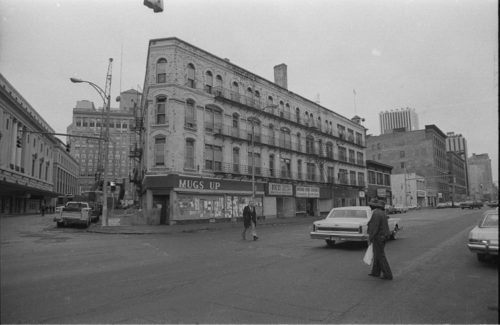 shots of the corner of Main and Gibbs Streets, taken from the north, before demolition of this side of the city block.