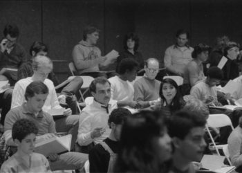 On the day of the recording session, December 10th, 1983, members of the chorus and the vocal soloists all participate in preliminaries.
