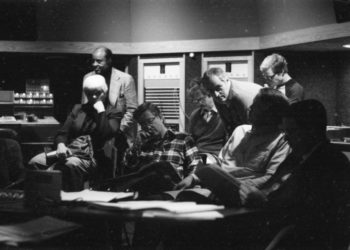 Principals gather in the control room to hear playbacks. Variously seen in these shots are conductor Donald Neuen, producer Ray Wright, recording engineer Ros Ritchie, harpsichordist Arthur Haas, and several of the vocal soloists.