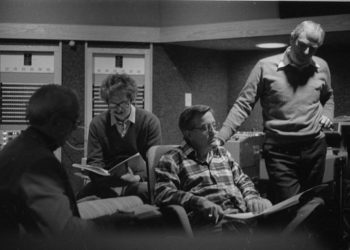 Principals gather in the control room to hear playbacks. Variously seen in these shots are conductor Donald Neuen, producer Ray Wright, recording engineer Ros Ritchie, harpsichordist Arthur Haas, and several of the vocal soloists.