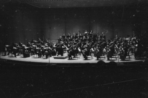 The Eastman Philharmonia performs under Sir Georg Solti’s direction in the Eastman Theater on April 7th, 1987.