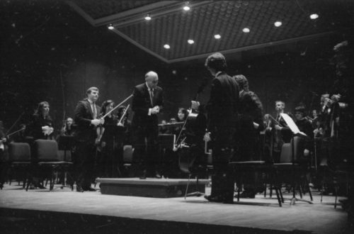 Maestro Georg Solti with the Eastman Philharmonia, acknowledging applause after their performance of Beethoven’s Symphony no. 5 on April 7th, 1987.