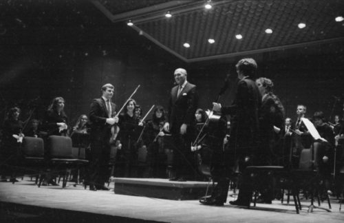 Maestro Georg Solti with the Eastman Philharmonia, acknowledging applause after their performance of Beethoven’s Symphony no. 5 on April 7th, 1987.