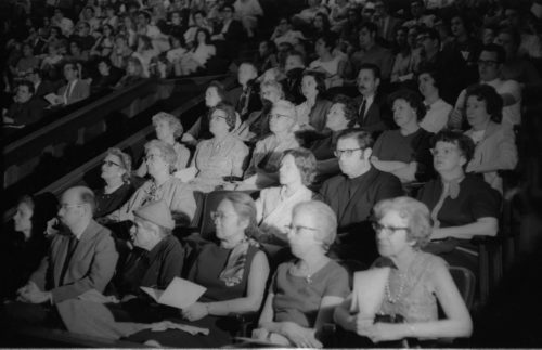 Two shots of audience members in Kilbourn Hall during the memorial service. Students, faculty members, and local citizens were all gathered together.