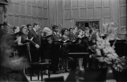 Members of the Eastman Chorale on-stage in Kilbourn Hall, conducted by Professor Milford Fargo. In the first two shots, baritone Joseph Bias (not holding a score) is the soloist.