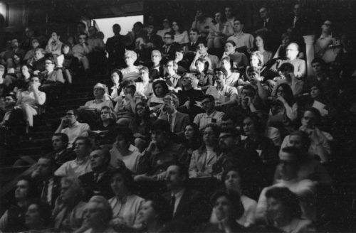 Two shots of audience members in Kilbourn Hall during the memorial service. Students, faculty members, and local citizens were all gathered together.