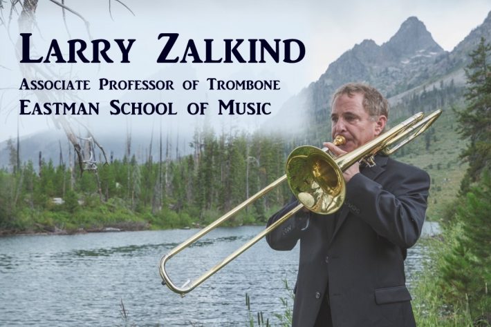 Larry Zalkind, Associate Professor of Trombone, Eastman School of Music, playing trombone with background of river and mountains