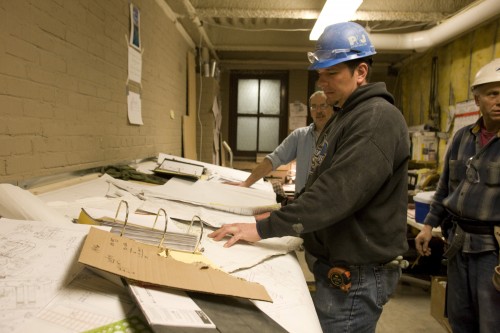 Reviewing construction plans on site