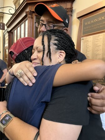Lauren hugs her mother, violinist Mellasenah Edwards '89E, in Lowry Hall