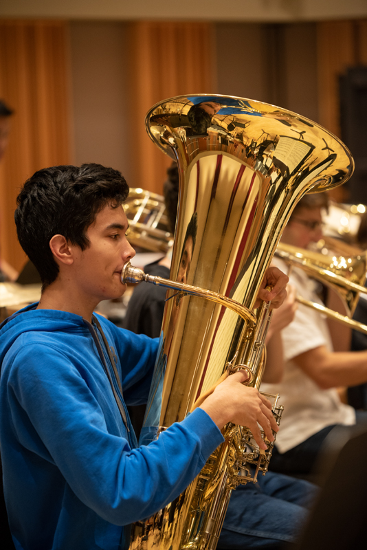 tuba student during Meliora Weekend rehearsal